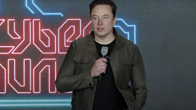 Logo for news article #2 (Tesla's 'Model 2' Is Here - What Does It Mean Ahead Of Earnings?)