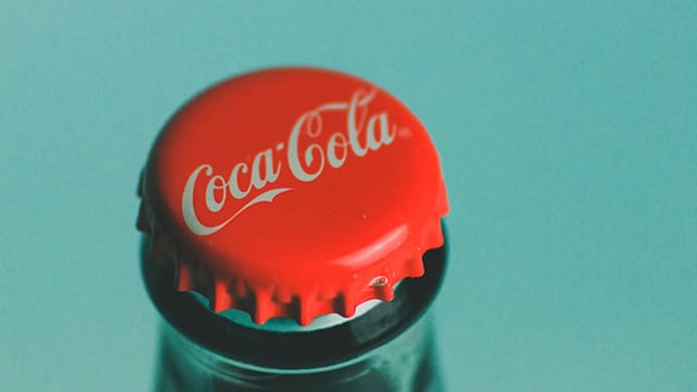 Logo for news article #1 (If You Buy Coca-Cola With $10,000 in 2025, Will You Become a Millionaire in 10 Years?)