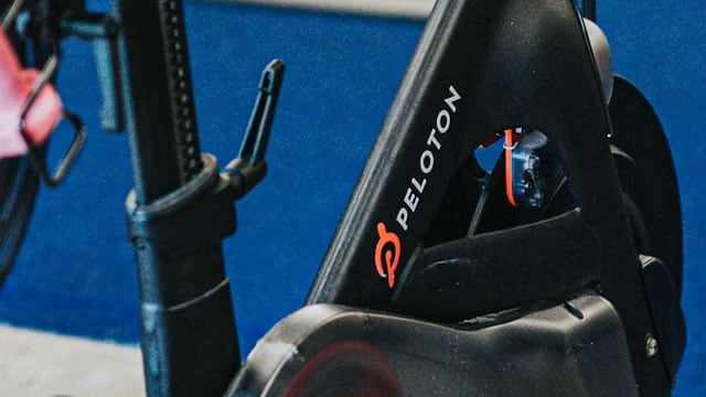 Logo for news article #1 (Peloton Sees Decline in Subscription Churn to 1.2% in Q3, Raises Full-Year Guidance)