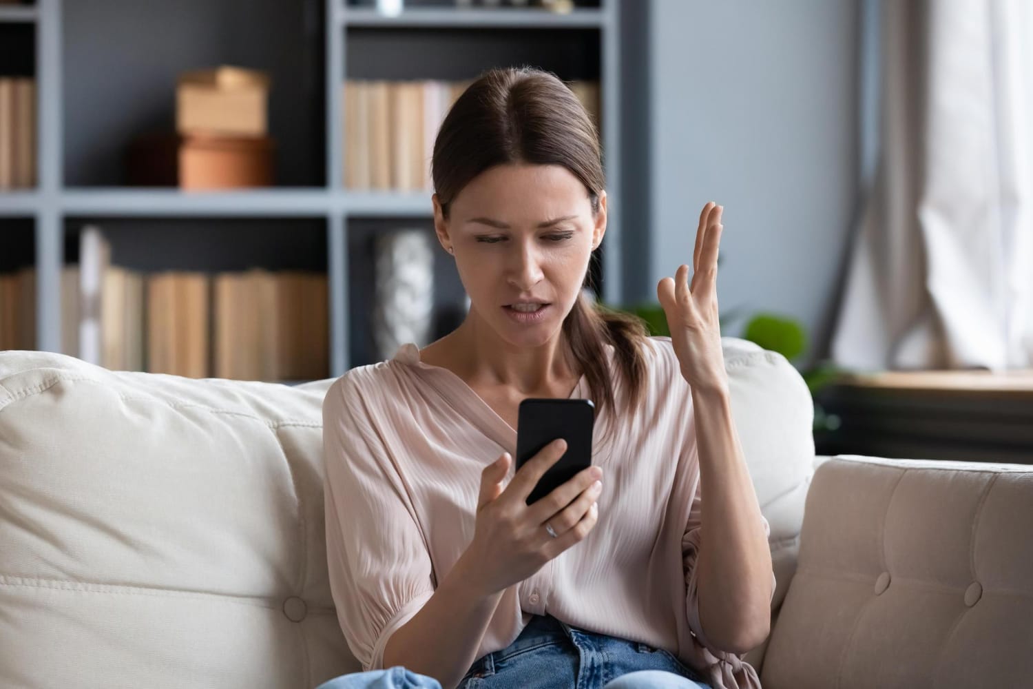 A young woman in distress, screaming as she struggles with managing her subscriptions without the Emma app.
